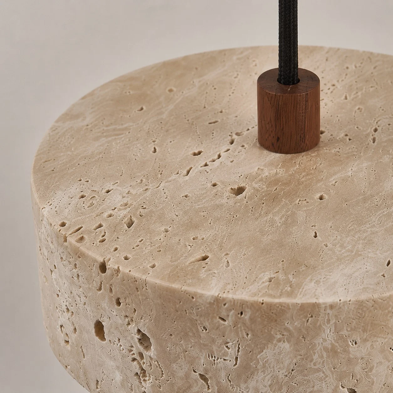 natural travertine texture and walnut connector detail