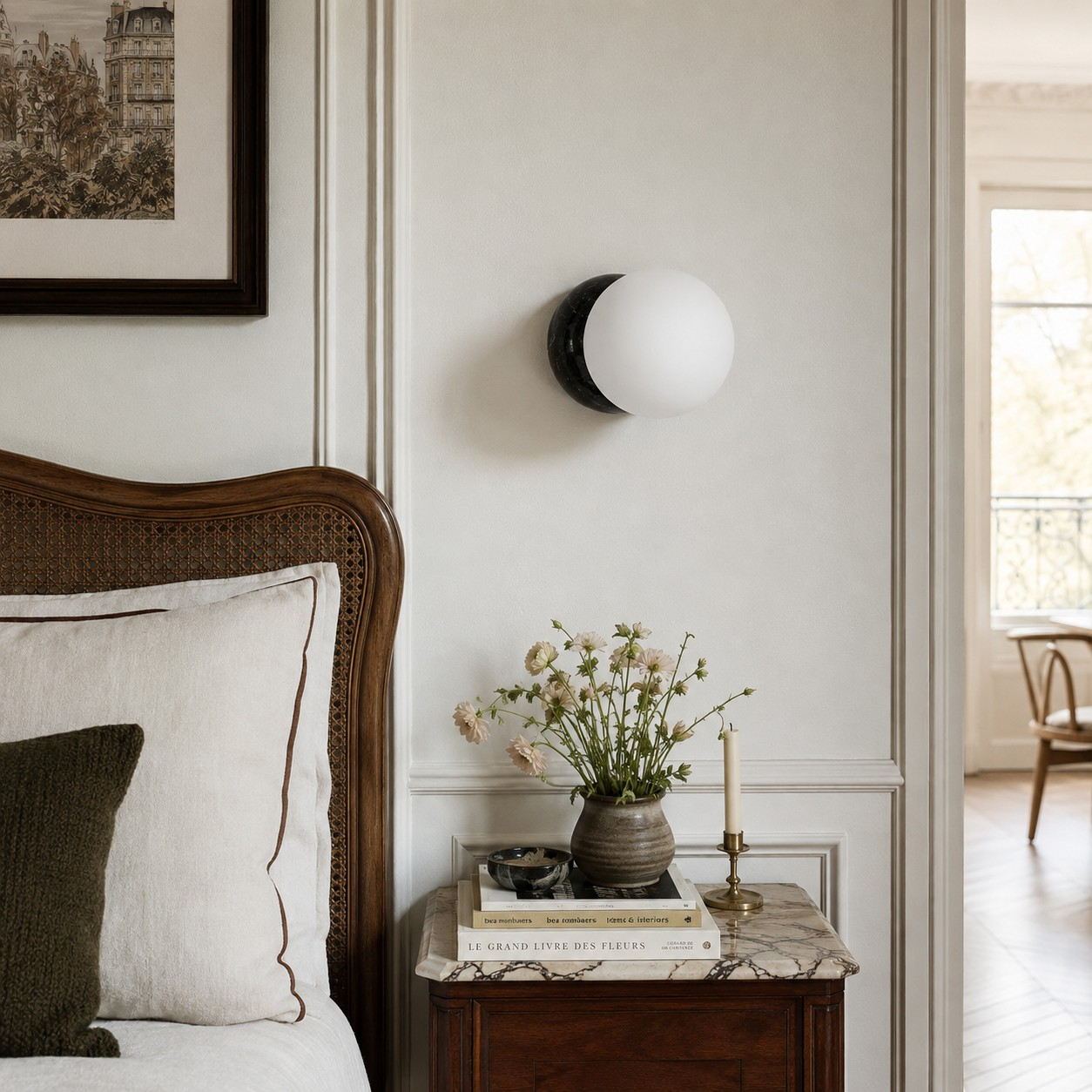 Black Marble globe wall sconce above a bedside table